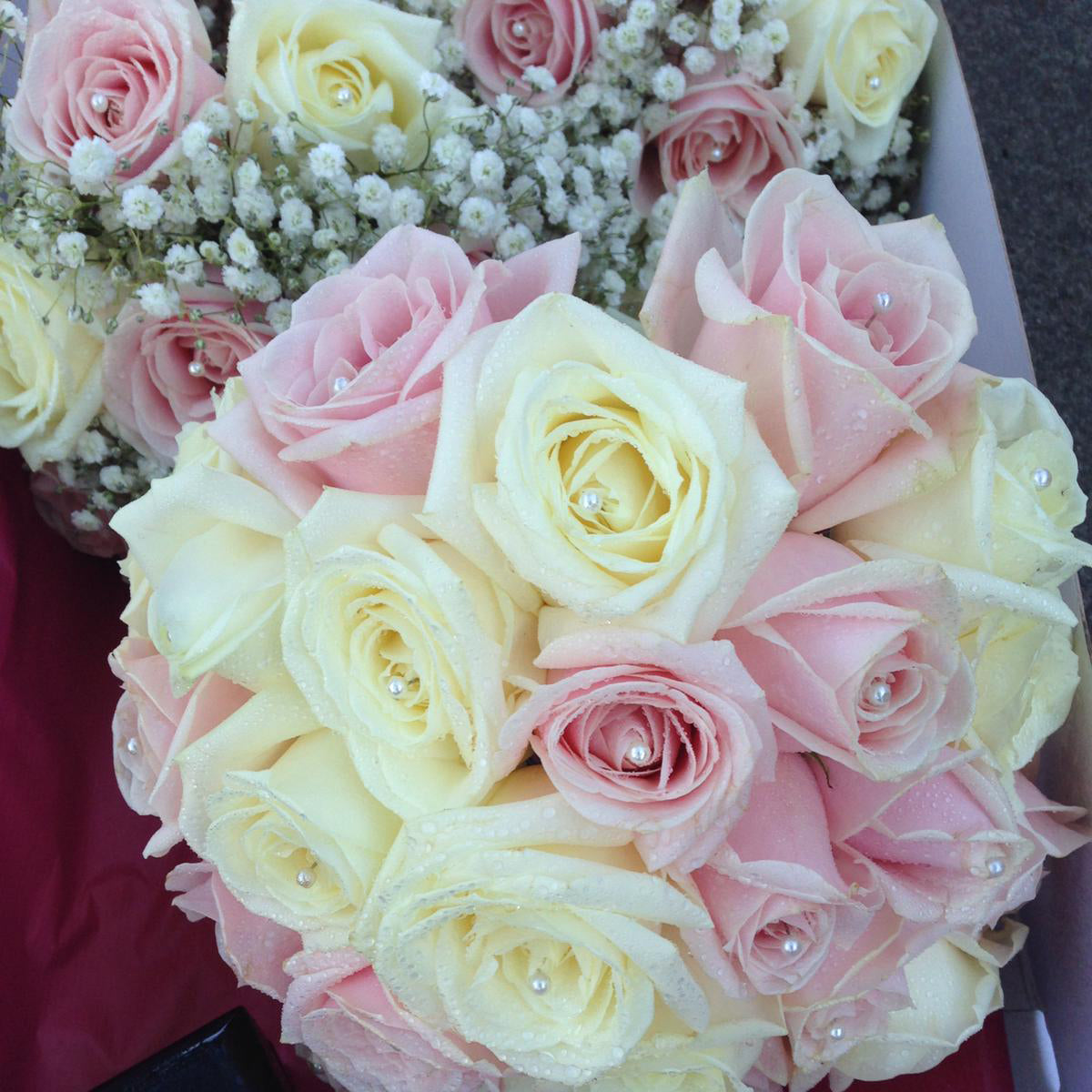 Bridesmaid hand-tied bouquet with fresh roses in pink and cream - copyright inspired flowers