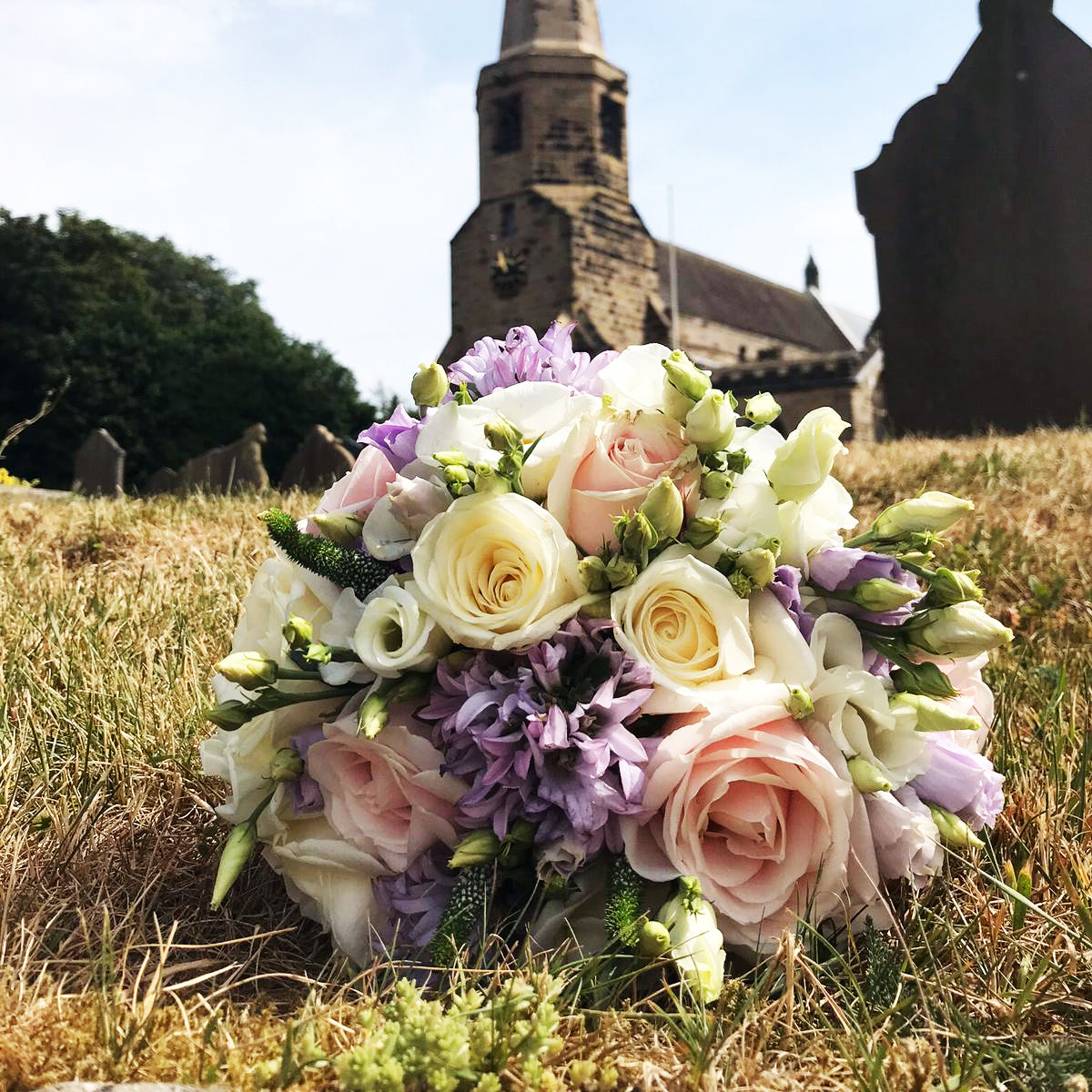 hand tied wedding bouquet blush pink lilac and creams with lisianthus roses and clematis - copyright inspired flowers