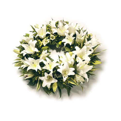 beautiful floral funeral wreath with lilies in cream