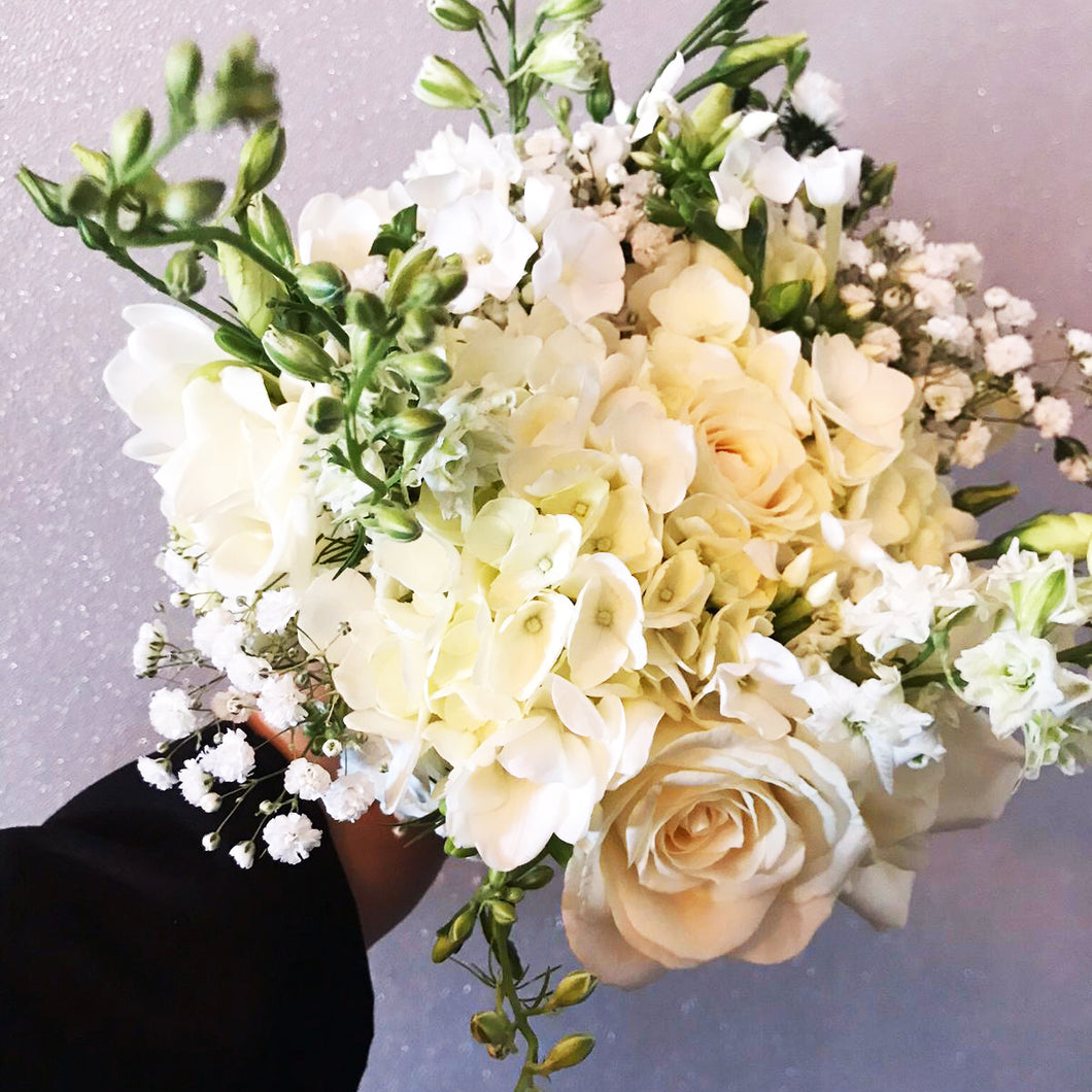 hand tied wedding bouquet including white rose hydrangea gypsophila - copyright inspired flowers 