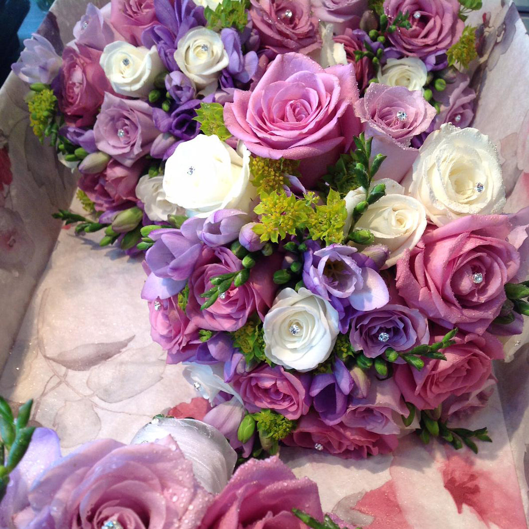 bride and bridesmaid bouquets in pink cream and lilac with roses and freesia - copyright inspired flowers