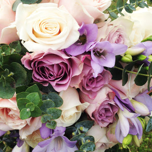 stunning wedding bouquet in pink lilac and mauve with roes and freesia - copyright inspired flowers