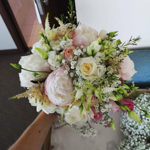 bridal bouquet soft pinks and creams with peonies and roses