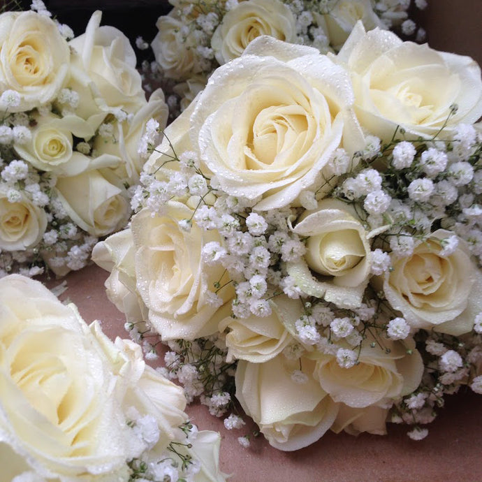 cream wedding hand-tied floral arrangements - copyright inspired flowers