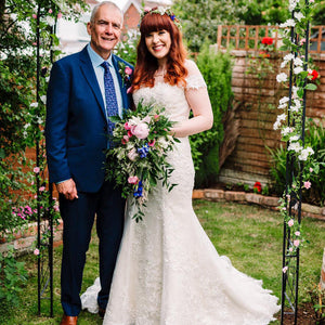 Bride holding gorgeous wedding flowers by Inspired Flowers Southport