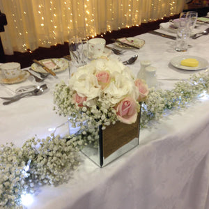 floral mirrored cube display for wedding - copyright inspired flowers