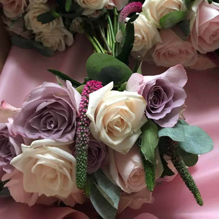 traditional wedding flowers with roses in pink and cream