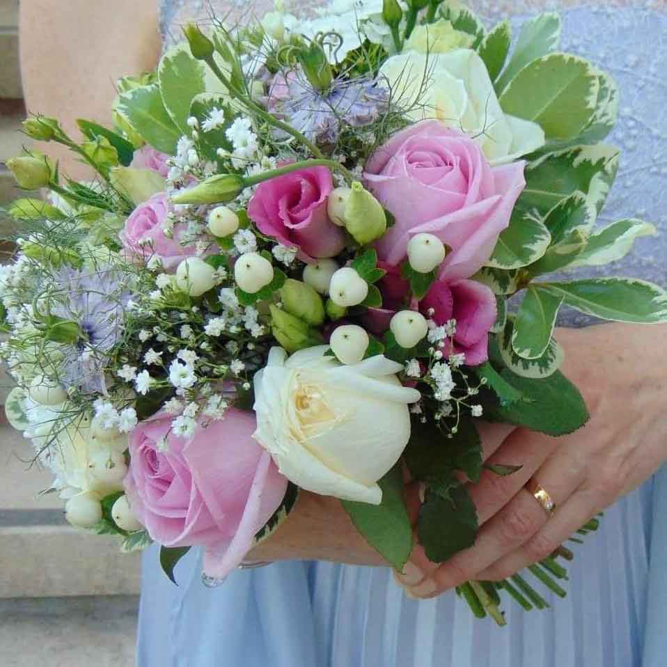 bright summer wedding flowers pink and cream hand tied flower