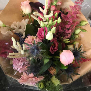 traditional country bouquet with pinks and peachs