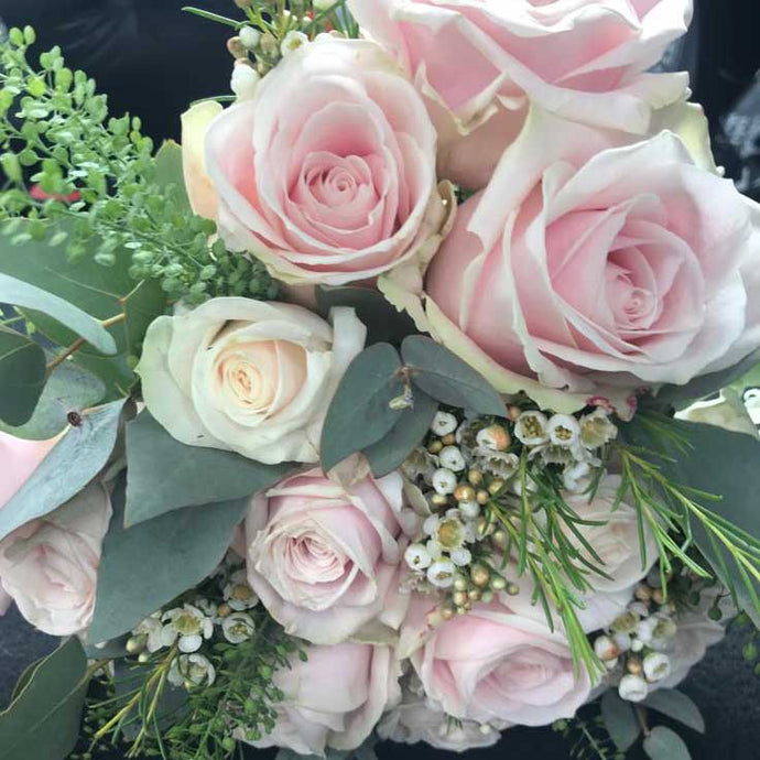 bridal flowers with pink pastel roses and foliage