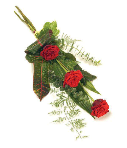 Stunning red rose hand-tied sheaf with seasonal foliage by Inspired Flowers