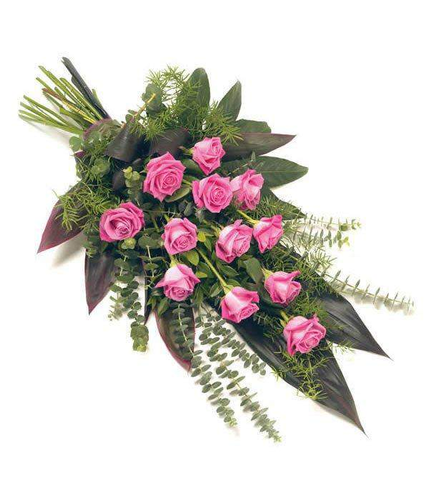 Dozen Roses Hand Tied Sheaf complemented perfectly with fresh foliage arranged by professional florist by Inspired Flowers 