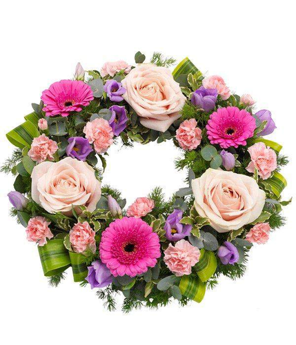 Pink Wreath with fresh dutch gerbra rose carnation and lisianthus flowers by Inspired Flowers