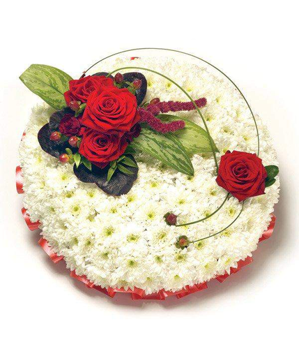 Red & White Posy Pad Arrangement massed chrysanthemums with red rose posy ribbon edge in red ribbon by Inspired Flowers