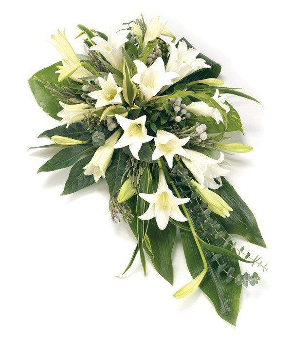 White Lily Single Ended Spray Using the most beautiful white oriental and longiflorum lilies, folded aspidistra leaves by Inspired Flowers 