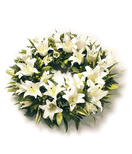 White Lily Wreath selection of the best white lily and seasonal foliage stunning floral arrangement by Inspired Flowers 