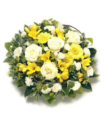 Yellow Posy Pad Arrangement  including Roses, fragranced Freesias, Carnations and complementing seasonal foliage by Inspired Flowers