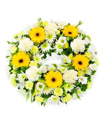 Yellow and White Wreath finest of yellows and creams to create a lovely traditional bright and fresh looking tribute by Inspired Flowers 